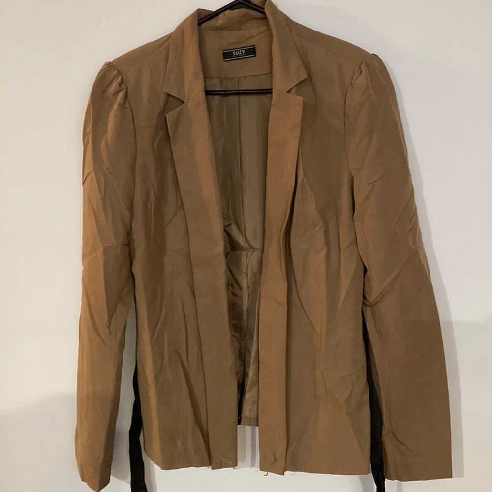 Tan coloured blazer with black belt